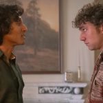 Armand (Assad Zaman) and Daniel Molloy (Luke Brandon Field) facing each other in an apartment