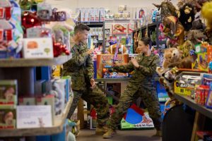 Janel Parrish and Parker Young in Christmas on Duty. Photo: Hallmark