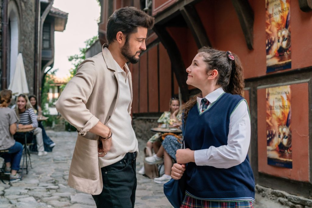 Tyler Hynes, Chloe Raphael on an Italian street in The Groomsmen: Last Dance. Photo: Hallmark Media/Photographer: Elena Nenkof