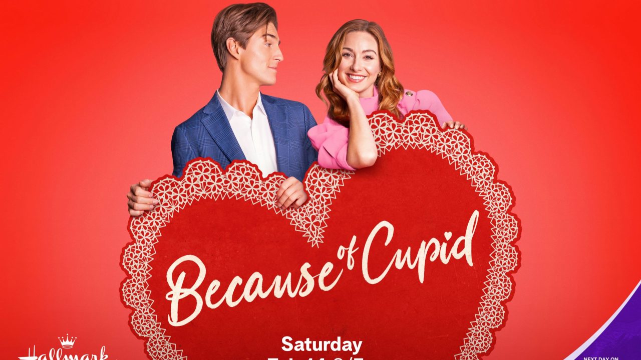 Evan Roderick and Amy Groening pose with a big heart in key art for Because of Cupid. Photo: Hallmark Media