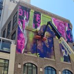 The Vampire Lestat building wrap at SDCC 2026 featuring Sam Reid, Jacob Anderson, Delainey Hayles, Eric Bogosian, Assad Zaman and Jennifer Ehle. Photo: Sarabeth Pollock