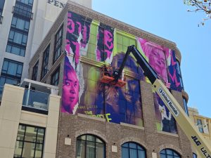 The Vampire Lestat building wrap at SDCC 2026 featuring Sam Reid, Jacob Anderson, Delainey Hayles, Eric Bogosian, Assad Zaman and Jennifer Ehle. Photo: Sarabeth Pollock