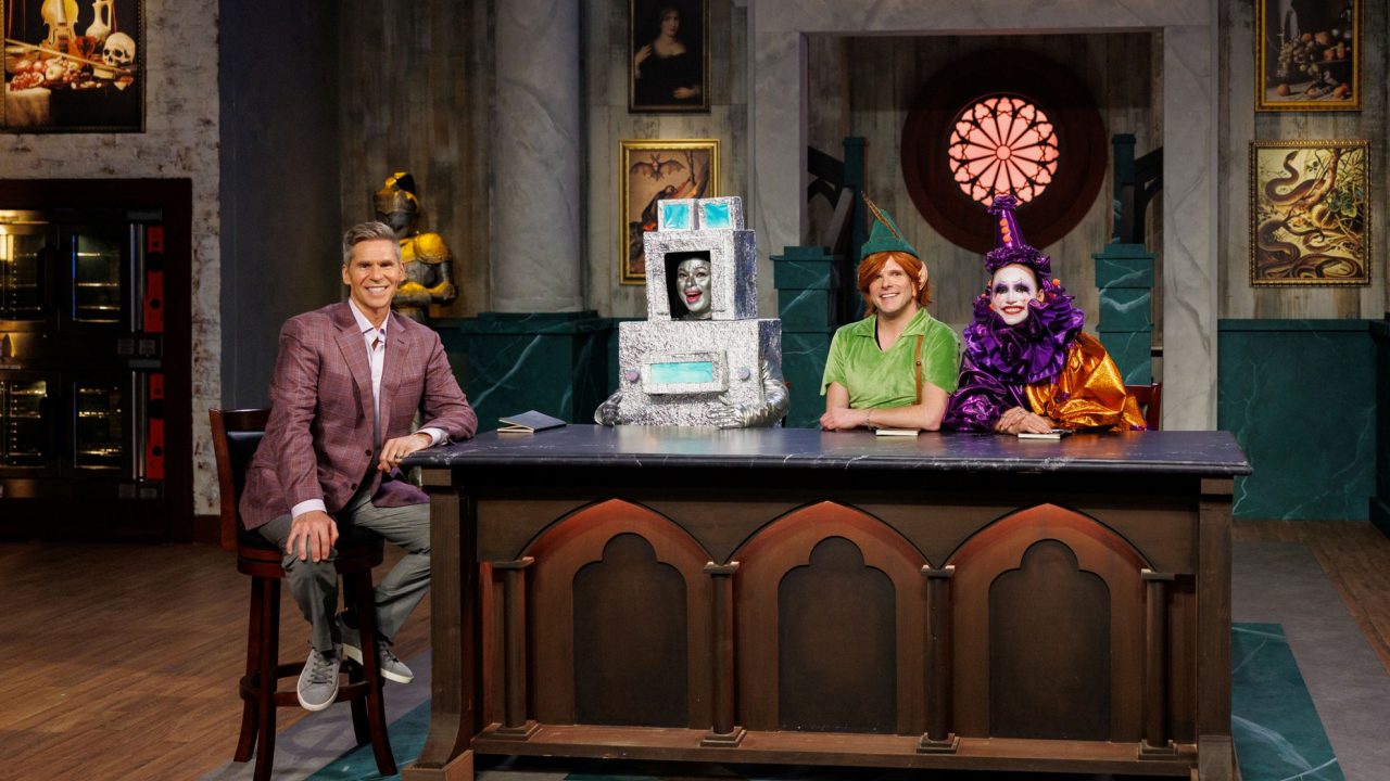 Host John Henson, with judges Aarti Sequeira, Zac Young and Stephanie Boswell as seen on Halloween Baking Championship season 12. Photo: Food Network